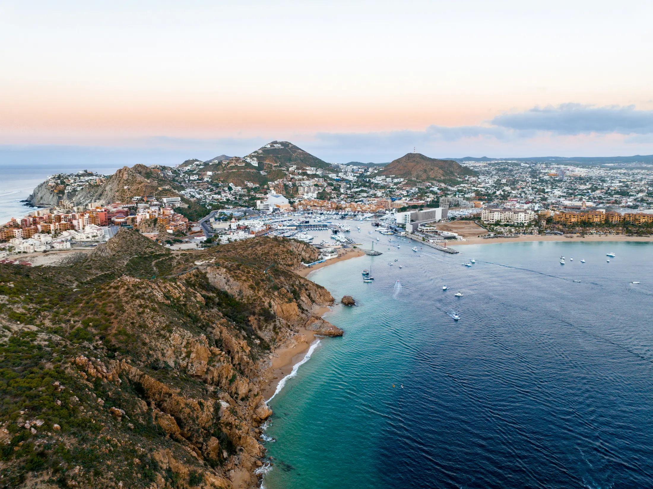 Aerial view of the Cabo San Lucas marina, downtown and surrounding residential hills